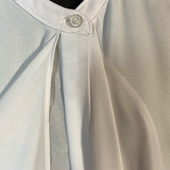 White sleeveless ruffle front blouse - Picture 3 of 8